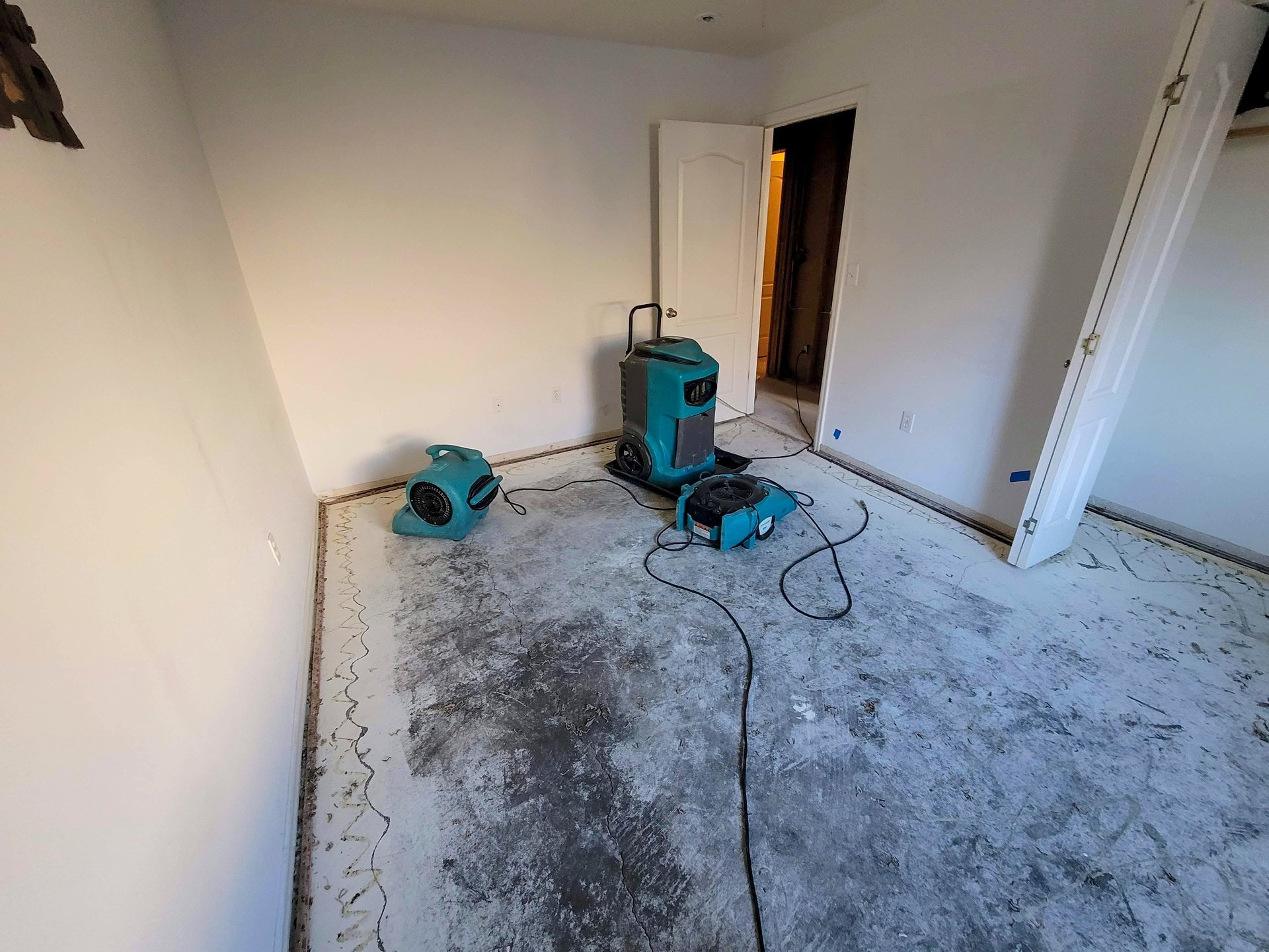 Water damaged Indianapolis home with air movers and a dehumidifier drying the structure